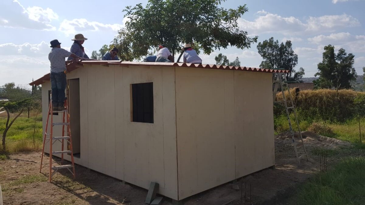 Flex employees building a home for families in Mexico